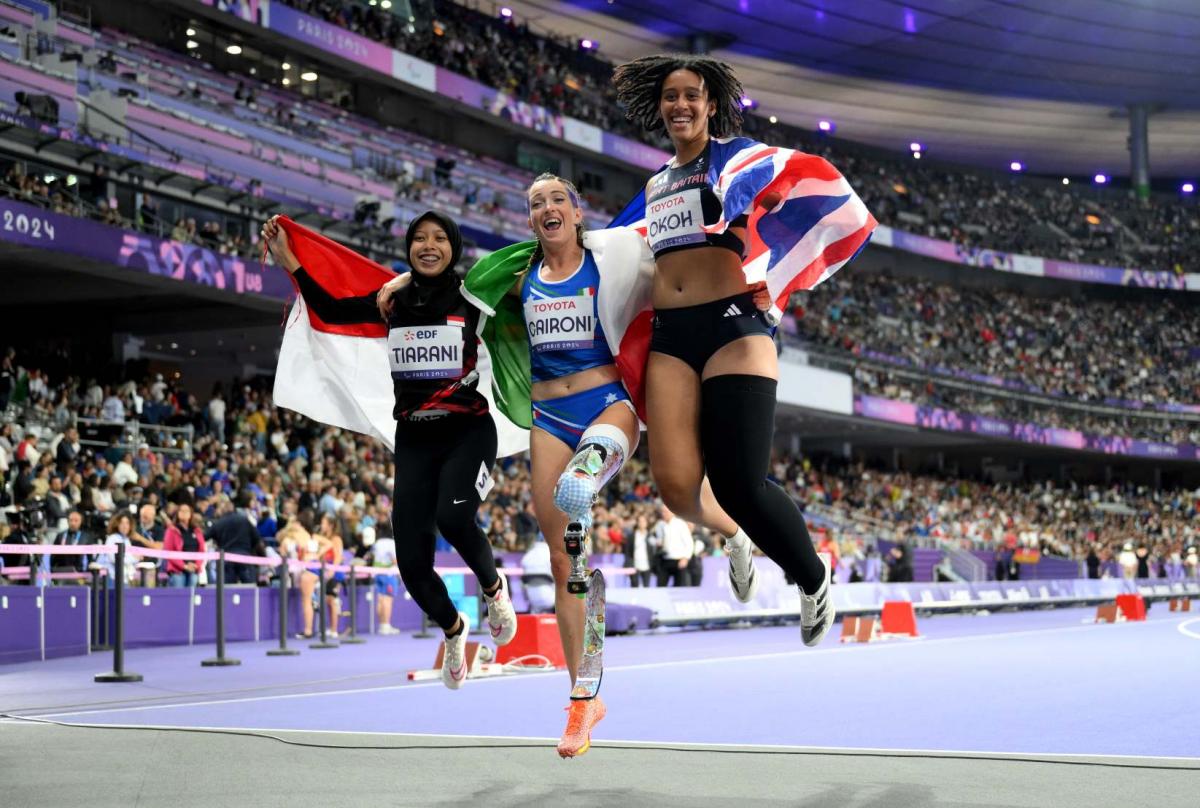 Athletes celebrate their medal